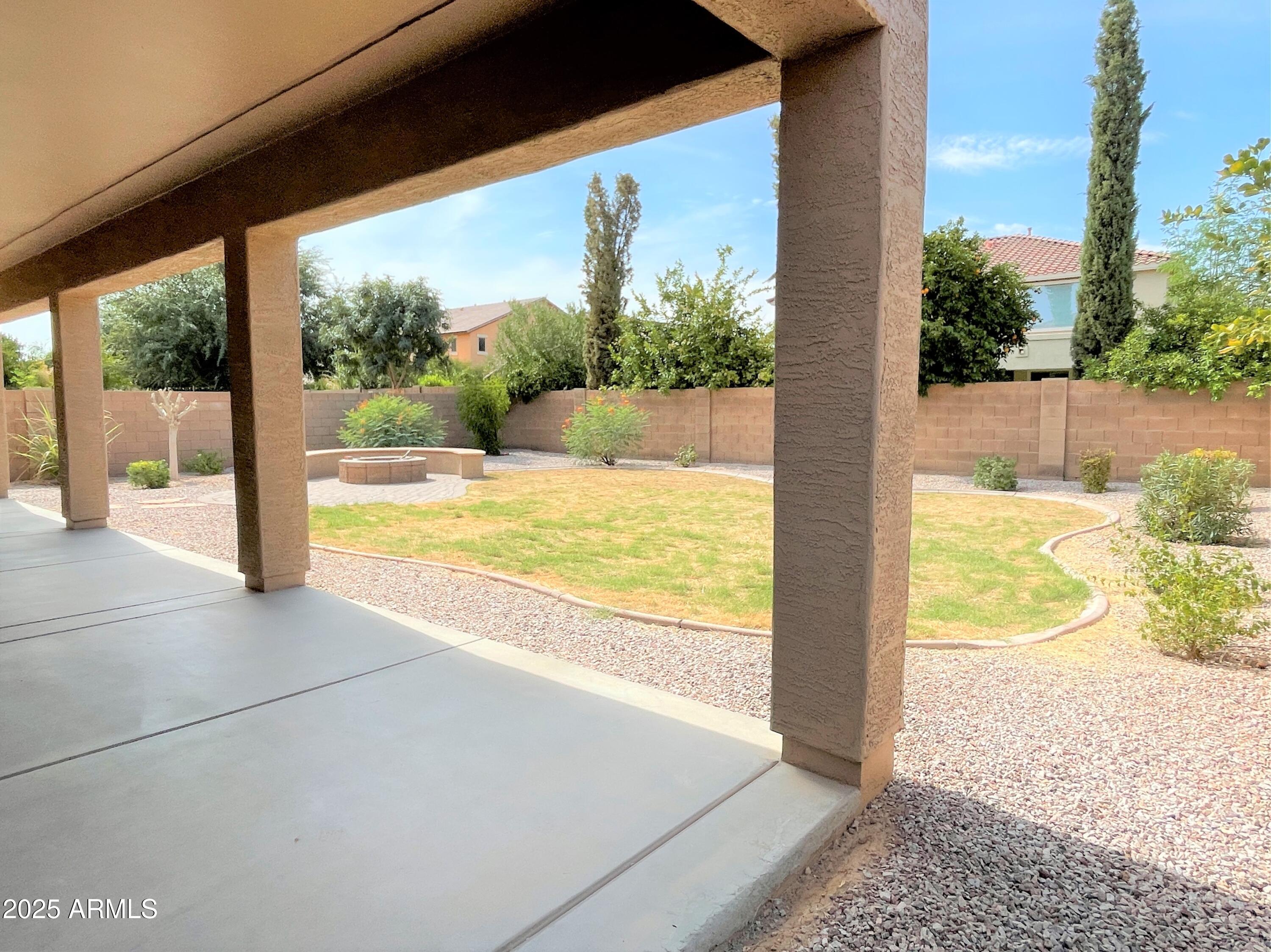 3663 East Sparrow Place Chandler, AZ 85286 - Photo 31 of 32 a view of a room with wooden floor and a floor to ceiling window