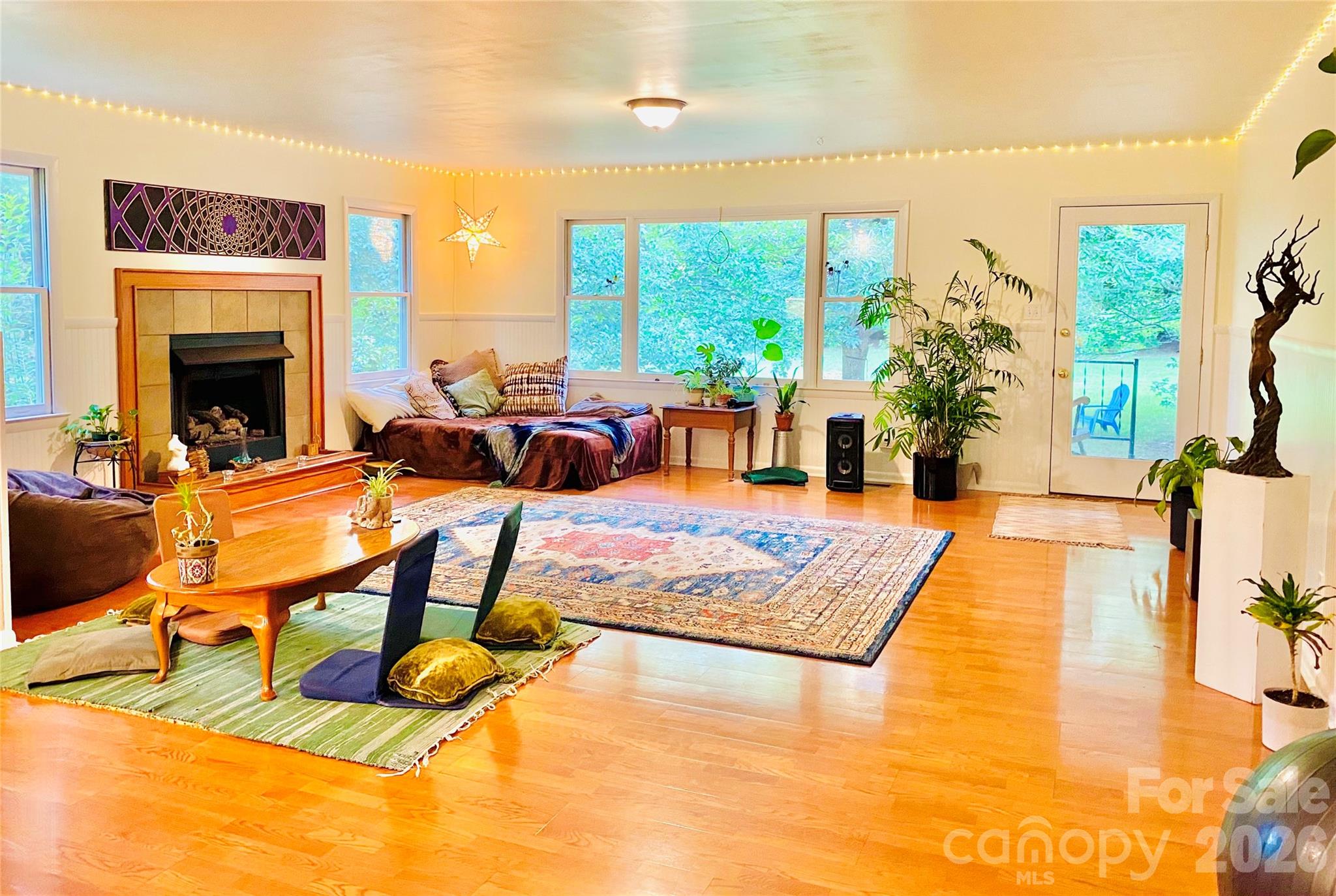 3 Taproot Trail Barnardsville, NC 28709 - Photo 14 of 48 a living room with patio furniture and a fireplace