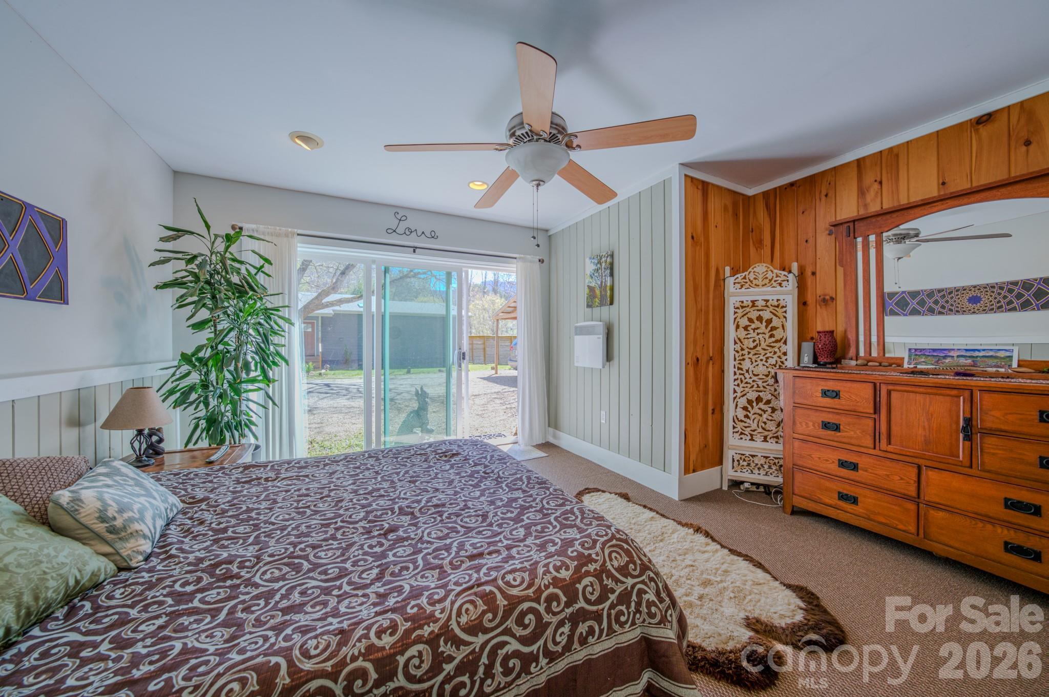 3 Taproot Trail Barnardsville, NC 28709 - Photo 25 of 48 a bedroom with a bed and large windows