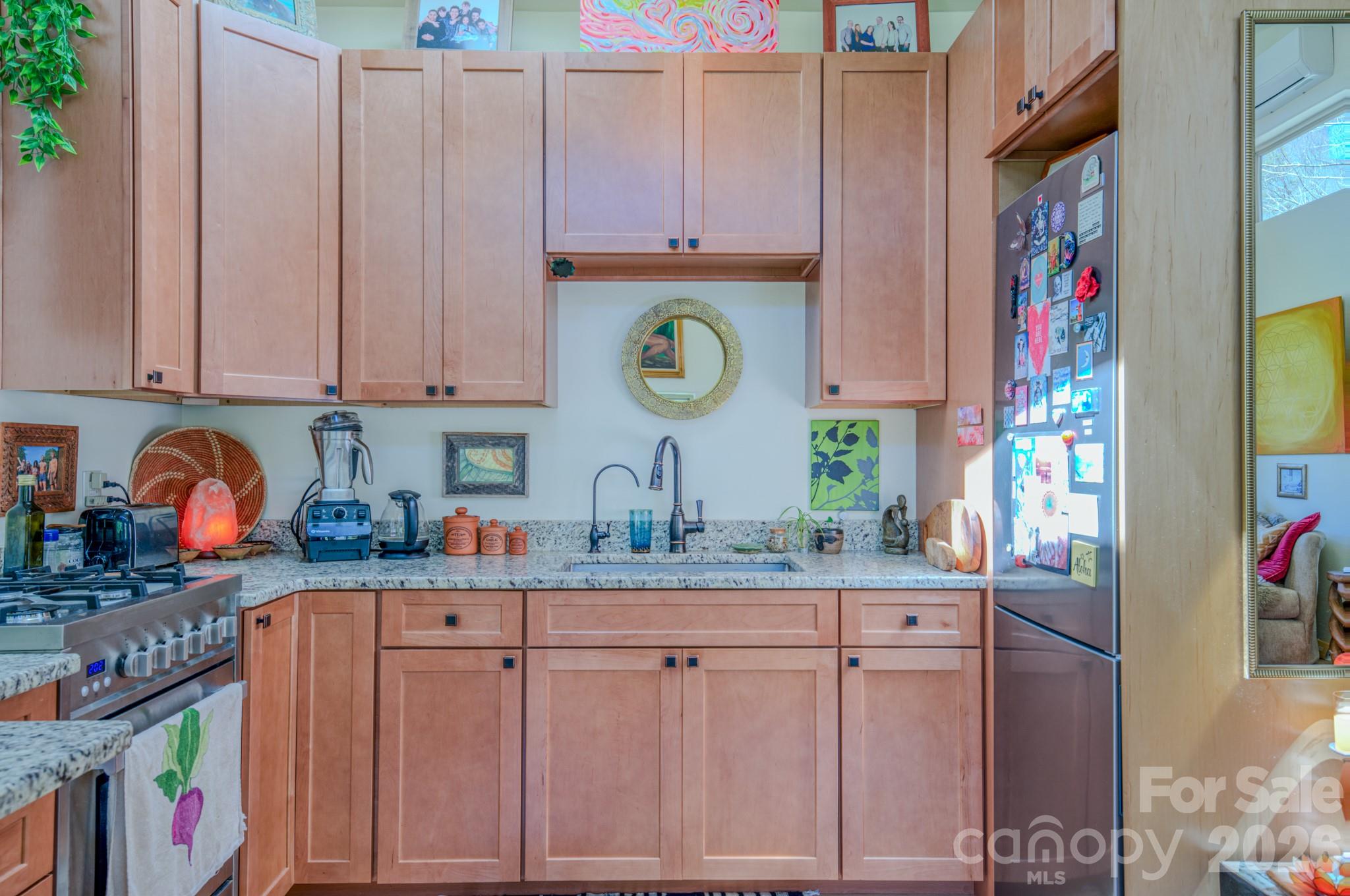 3 Taproot Trail Barnardsville, NC 28709 - Photo 32 of 48 a kitchen with stainless steel appliances granite countertop a sink and cabinets