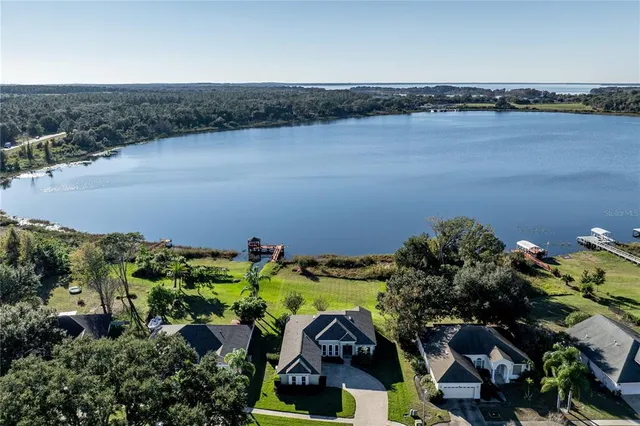 an aerial view of residential house with outdoor space and swimming pool
