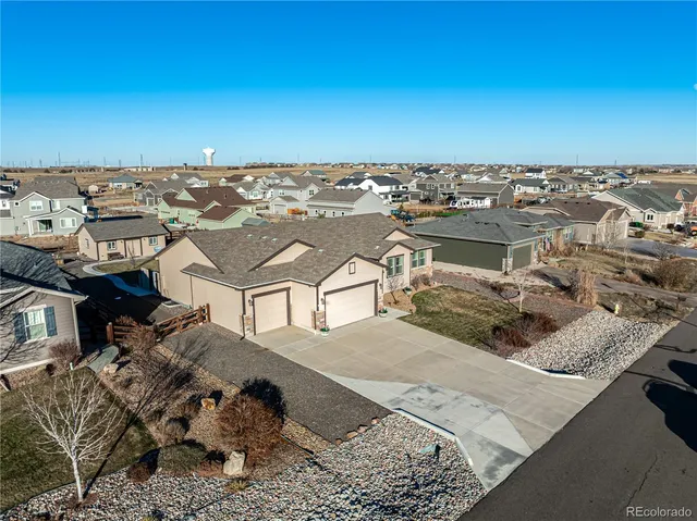 an aerial view of a house with a ocean view