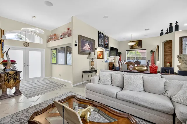 a view of a hallway with wooden floor and workspace