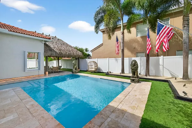 swimming pool view with seating space