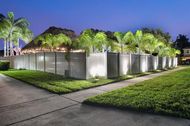 a front view of a house with a yard and a garage