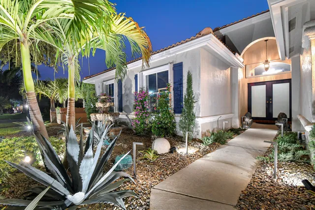 a front view of a house with garden