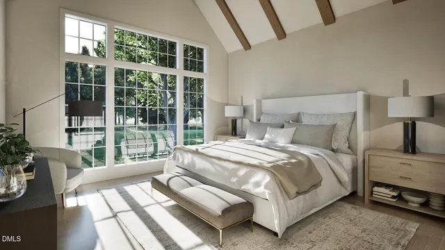 a bedroom with a bed and a large window