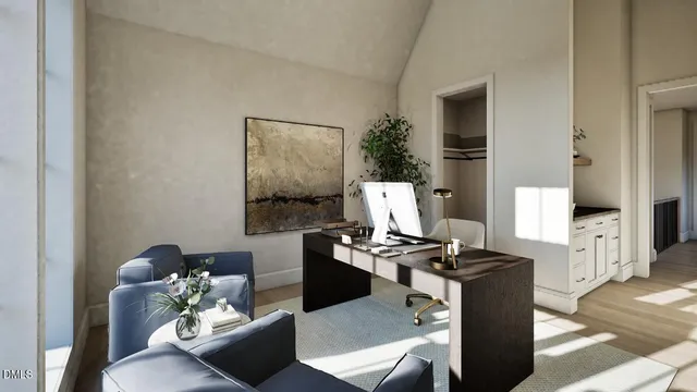 a view of utility room and bedroom with windows