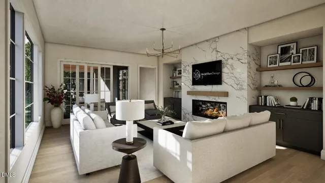a living room with furniture a flat screen tv and a fireplace