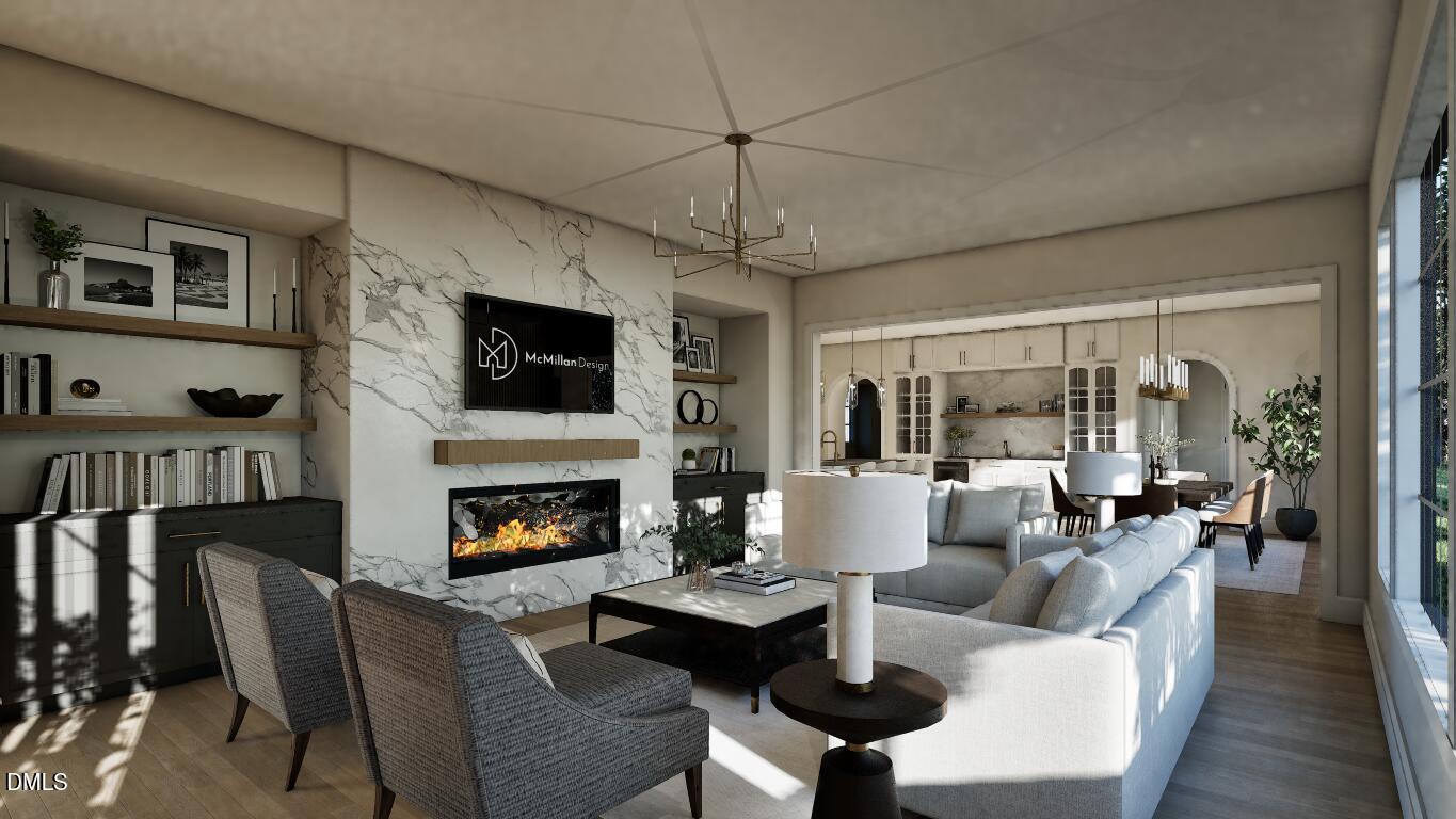 3032 Lewis Farm Road Raleigh, NC 27607 - Photo 10 of 34 a living room with furniture fireplace and a flat screen tv