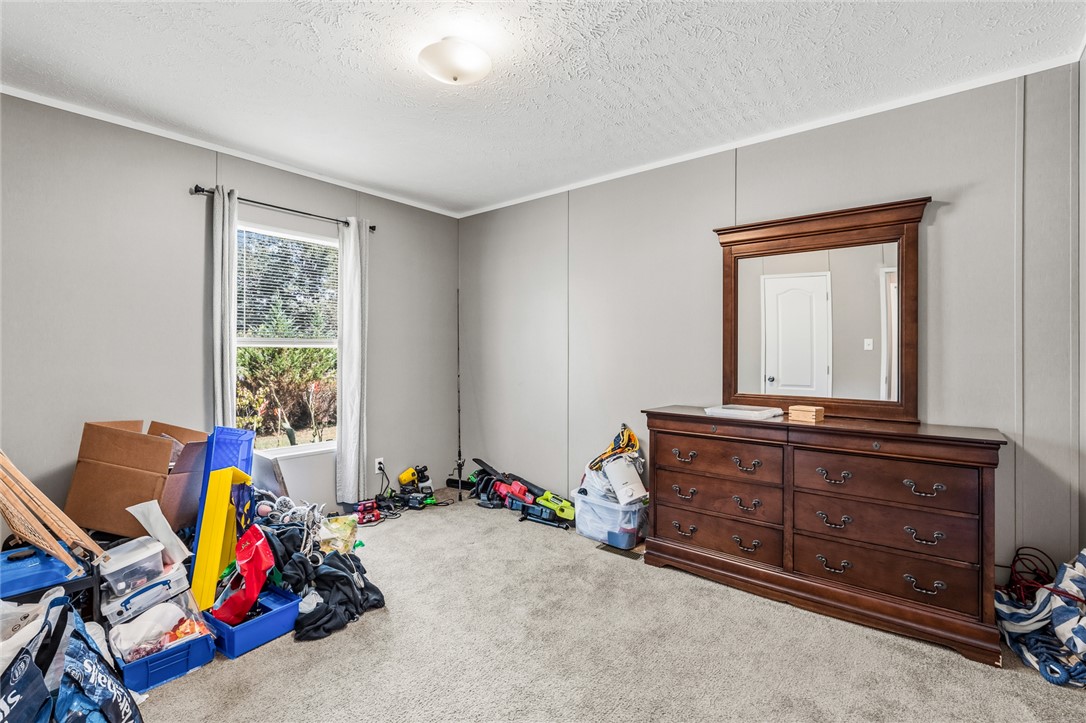 429 Gibson Road Anderson, SC 29625 - Photo 29 of 47 A single window draws natural light into this carpeted bedroom.