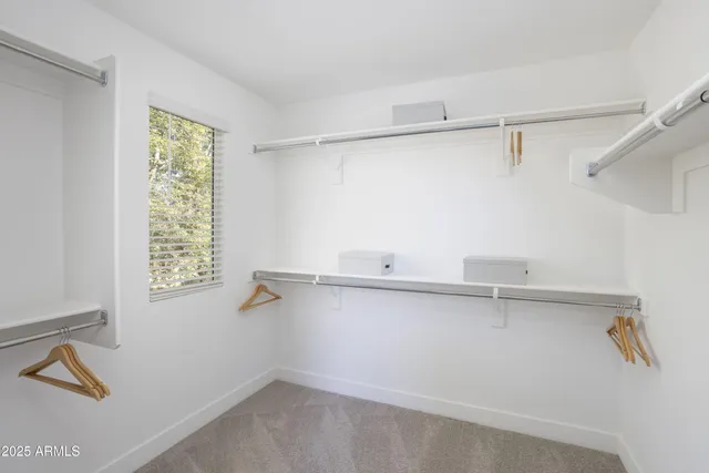 a close up of a sink and a window in an empty room