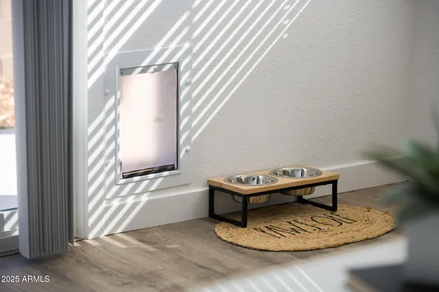a living room with furniture a window and a wooden floor