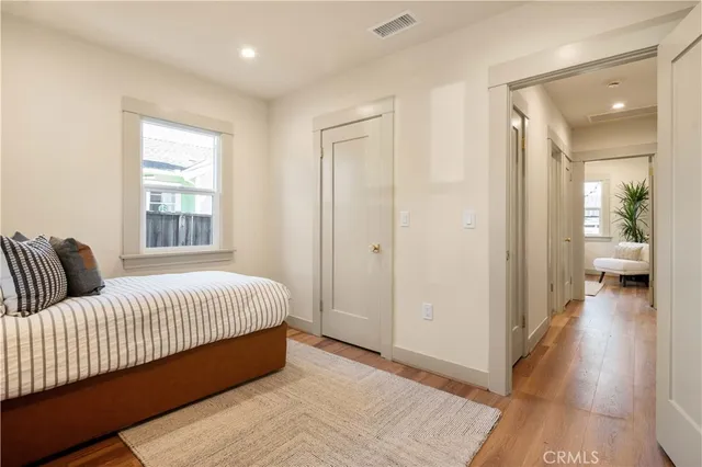 a front view of a house with a garden and patio