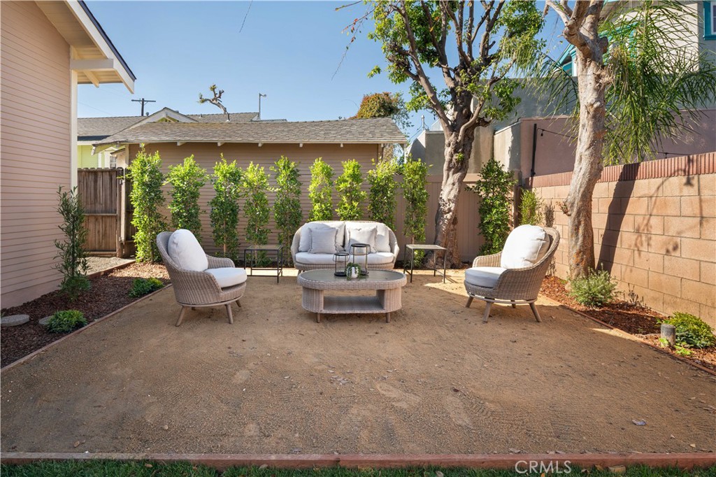 4245 East 6th Street Long Beach, CA 90814 - Photo 19 of 27 a roof deck with table and chairs under an umbrella