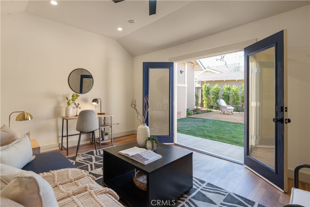 4245 East 6th Street Long Beach, CA 90814 - Photo 22 of 27 a living room with furniture and a floor to ceiling window