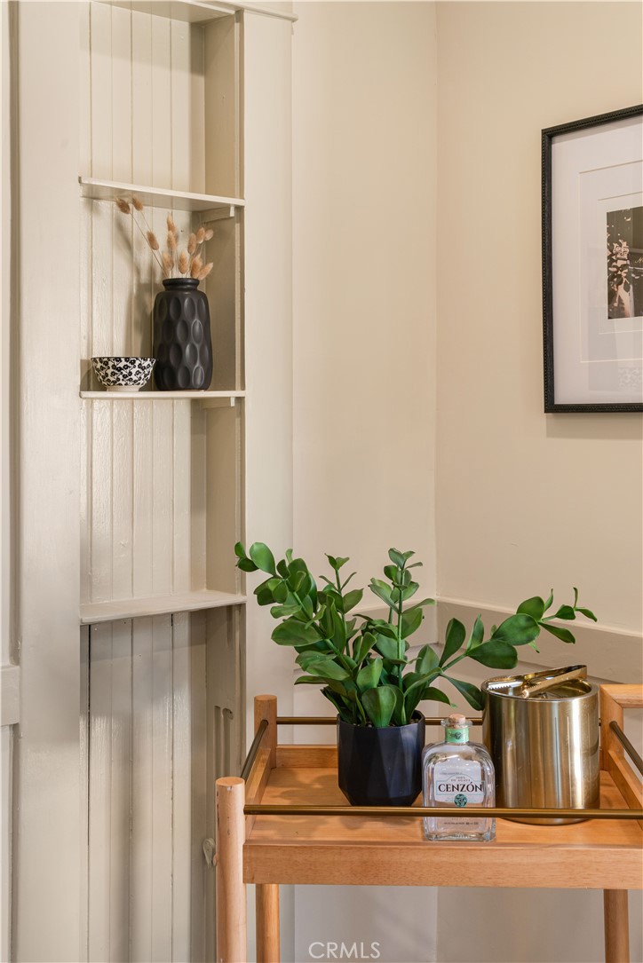 4245 East 6th Street Long Beach, CA 90814 - Photo 23 of 27 a potted plant sitting on top of a shelf
