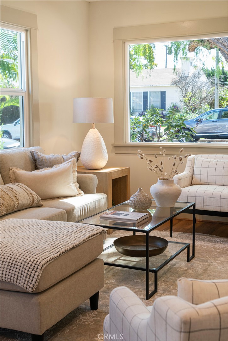 4245 East 6th Street Long Beach, CA 90814 - Photo 25 of 27 a living room with furniture and a floor to ceiling window
