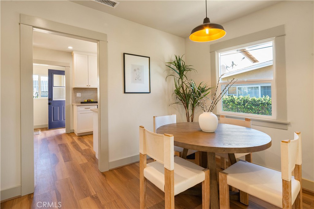4245 East 6th Street Long Beach, CA 90814 - Photo 6 of 27 a view of a dining room with furniture and wooden floor