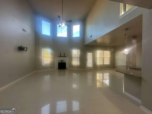 a view of a room with kitchen and living room