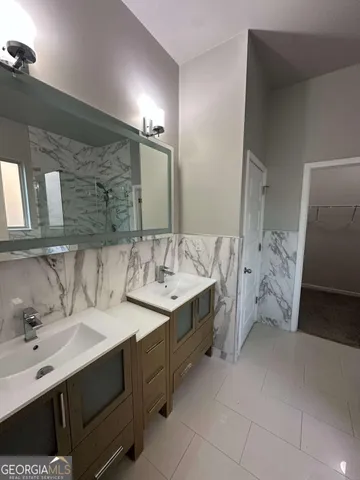 a bathroom with a bathtub and shower