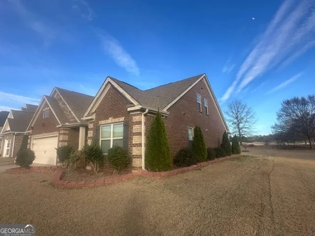 a view of a house with a street