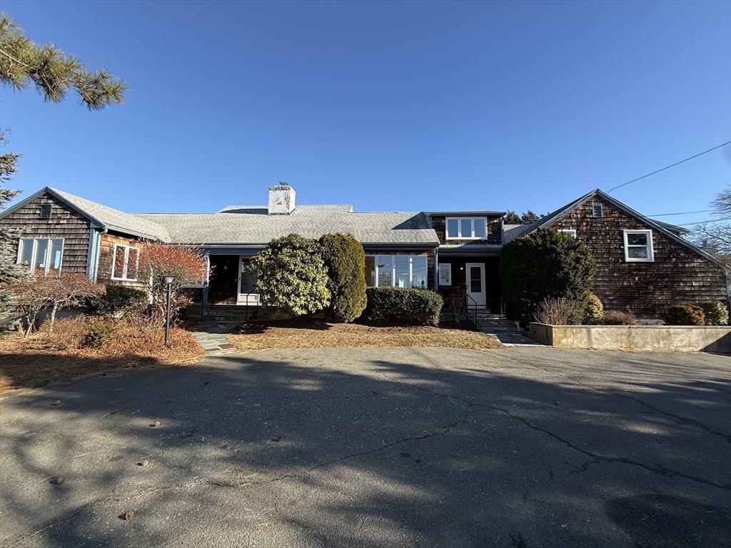 5 Winter Island Road Salem, MA 01970 - Photo 4 of 22 a front view of a house with a yard