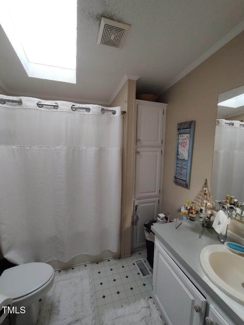 2960 Federal Road Benson, NC 27504 - Photo 35 of 45 Guest Bath is spacious and has a sky light