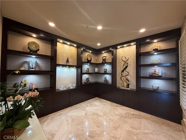 a kitchen with stainless steel appliances granite countertop a stove refrigerator and cabinets