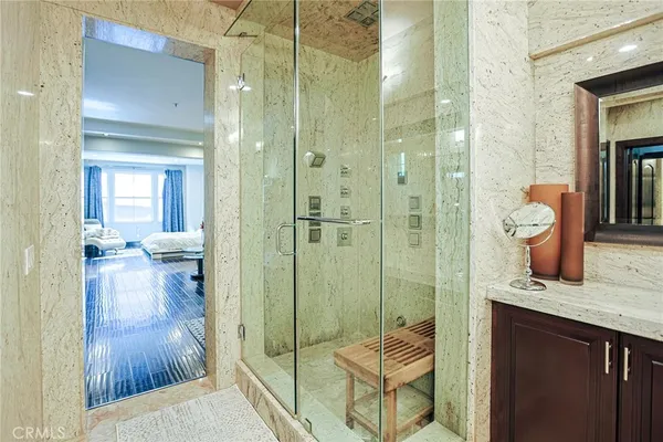a spacious bathroom with a double vanity sink double mirror and bathtub