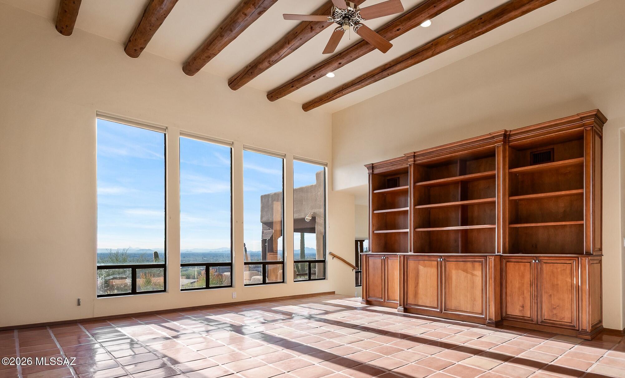 13630 East Sahuaro Sunset Road Tucson, AZ 85749 - Photo 5 of 47 a view of an empty room with a window