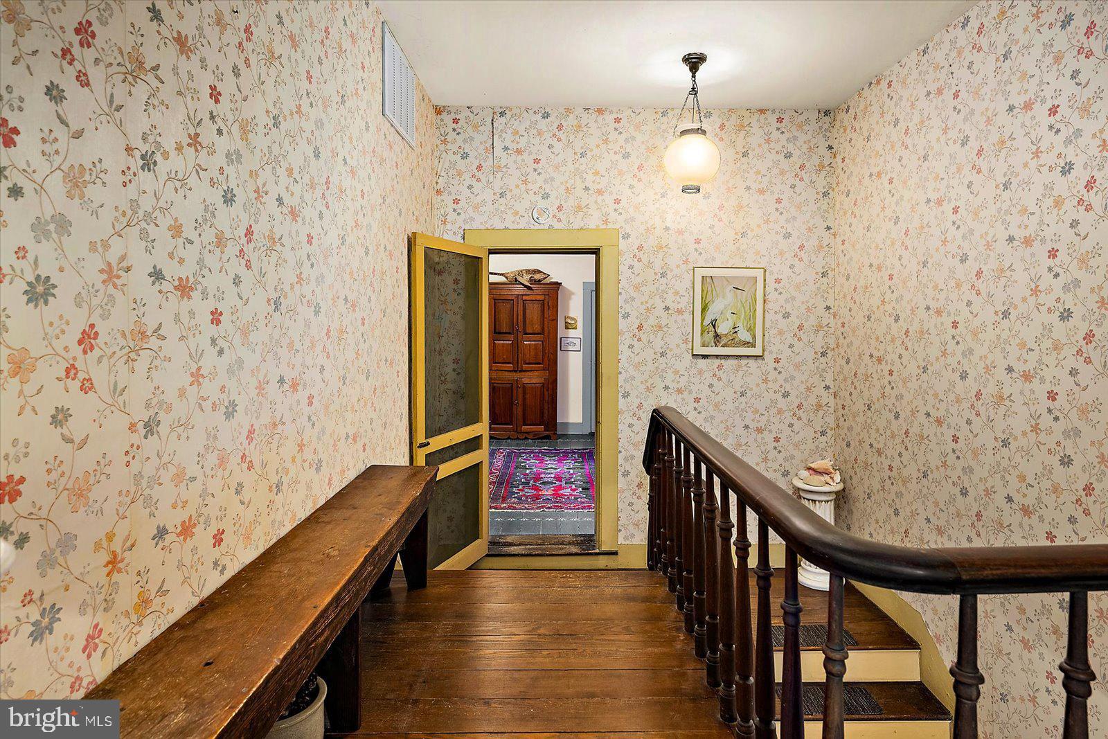 27947 Fairmount Road Westover, MD 21871 - Photo 107 of 122 a view of a hallway with wooden floor and staircase