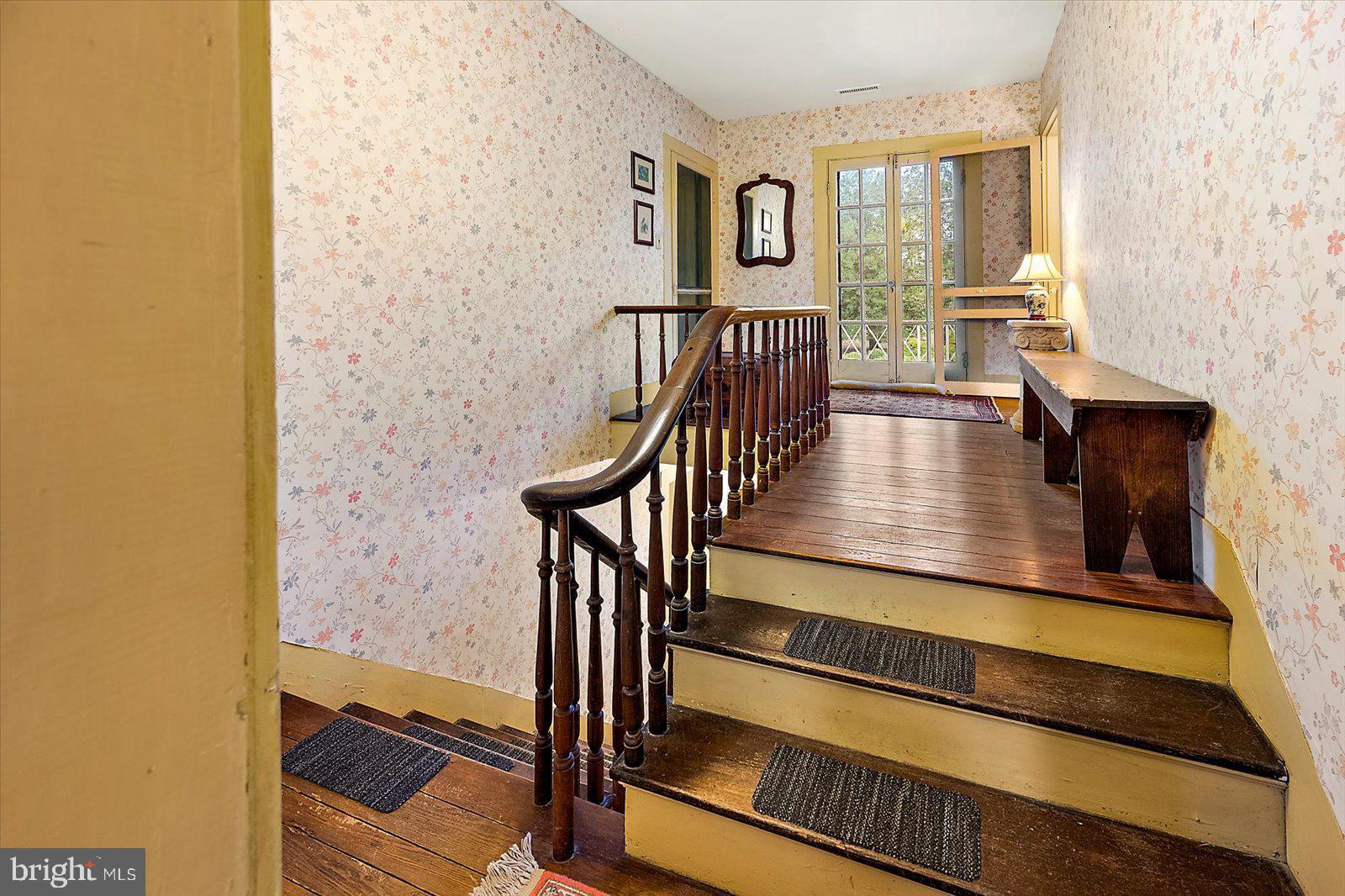 27947 Fairmount Road Westover, MD 21871 - Photo 108 of 122 a view of a hallway with wooden floor and staircase