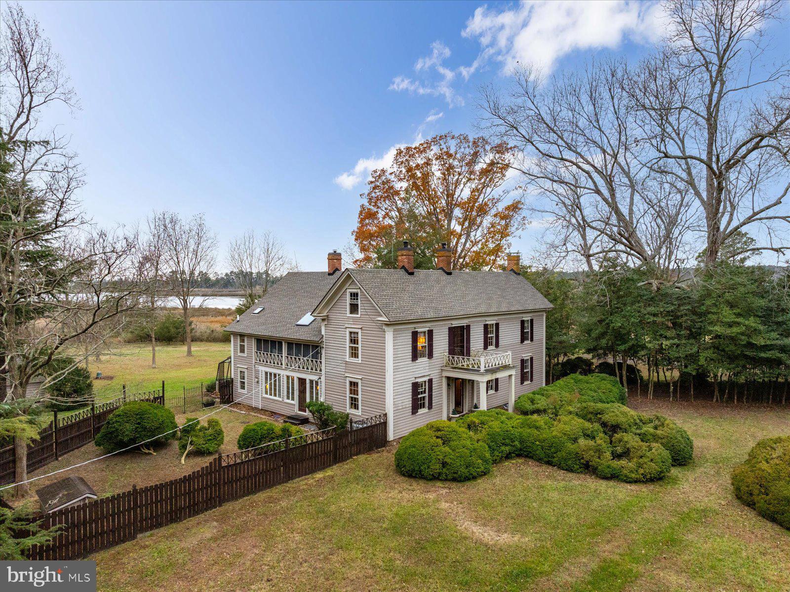 27947 Fairmount Road Westover, MD 21871 - Photo 51 of 122 a front view of a house with a yard and potted plants