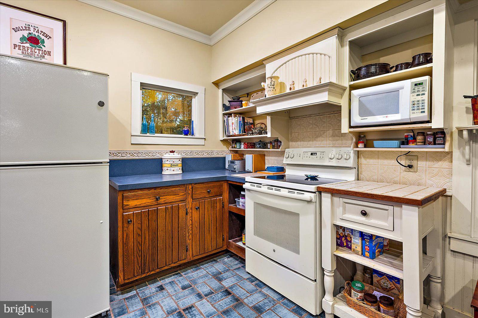 27947 Fairmount Road Westover, MD 21871 - Photo 67 of 122 a kitchen with stainless steel appliances granite countertop a stove and a refrigerator