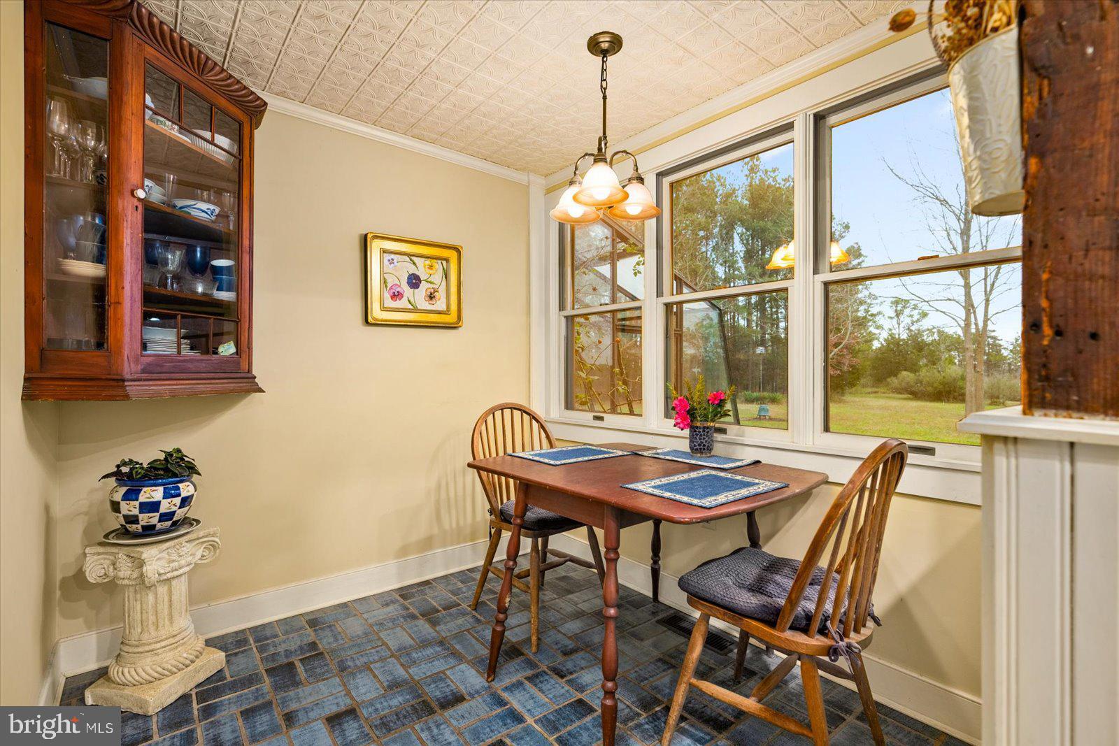 27947 Fairmount Road Westover, MD 21871 - Photo 71 of 122 a view of a dining room with furniture wooden floor and a chandelier