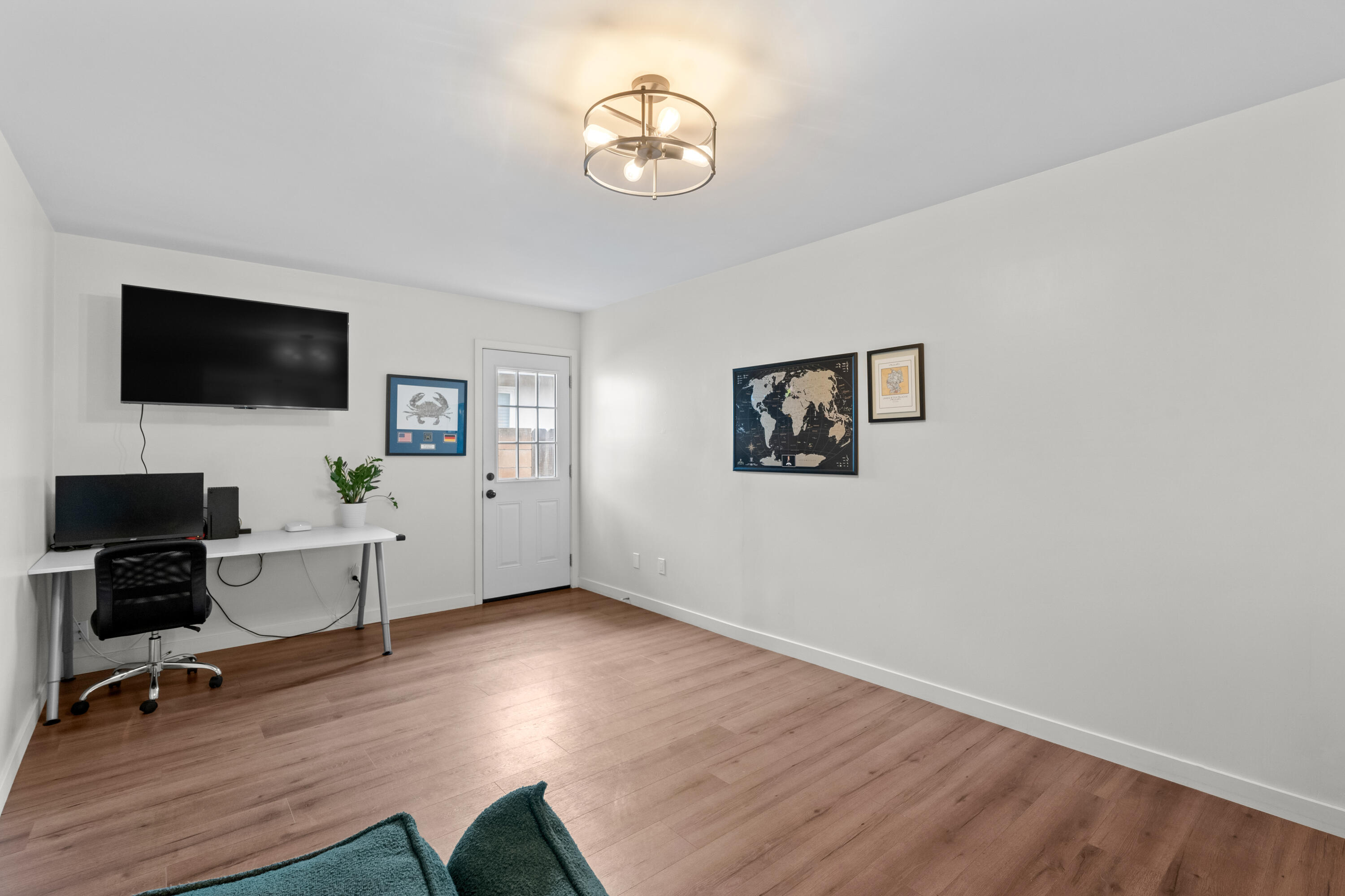 1220 West Lime Avenue Lompoc, CA 93436 - Photo 16 of 48 a view of a workspace with wooden floor and a window