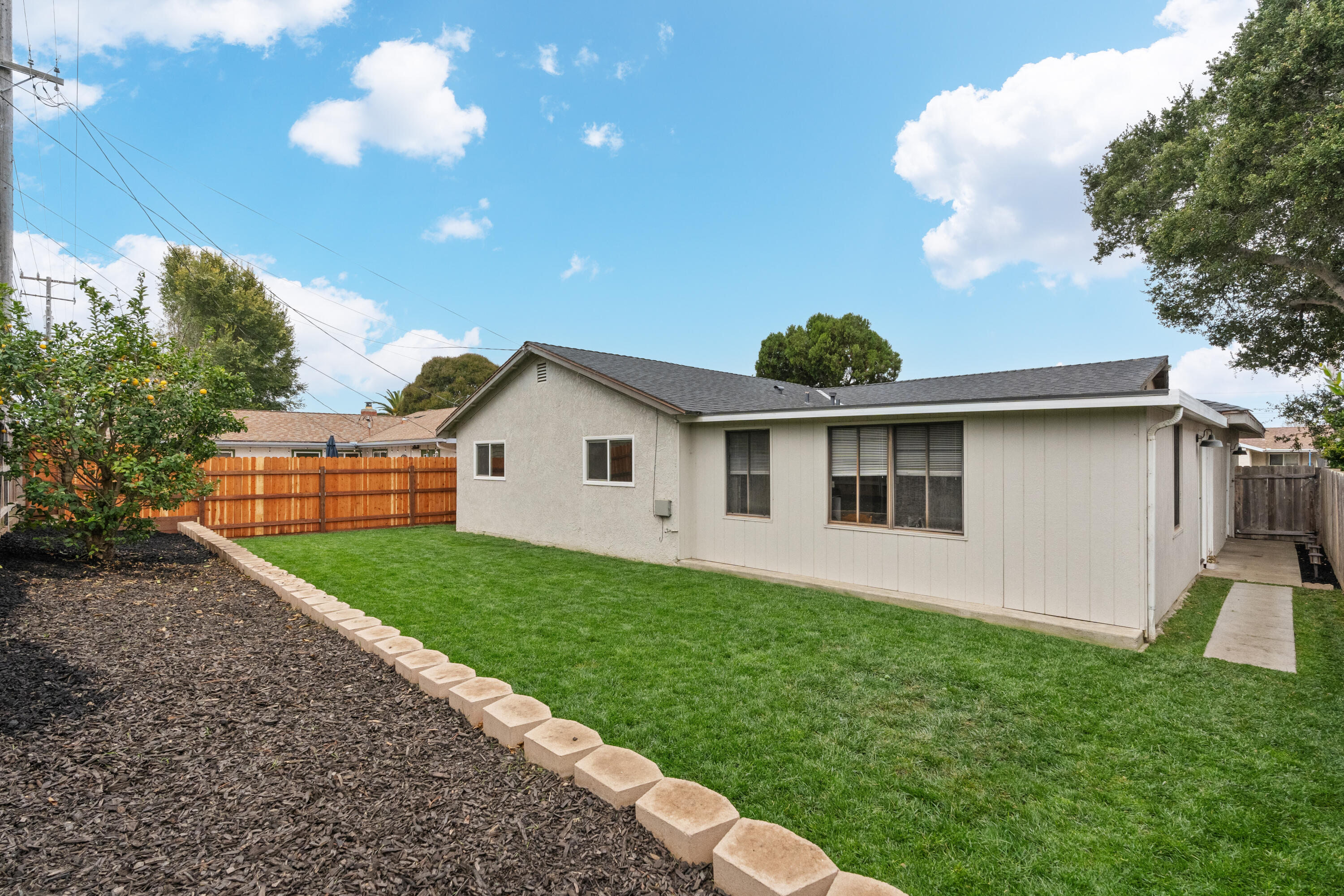 1220 West Lime Avenue Lompoc, CA 93436 - Photo 31 of 48 a front view of a house with garden