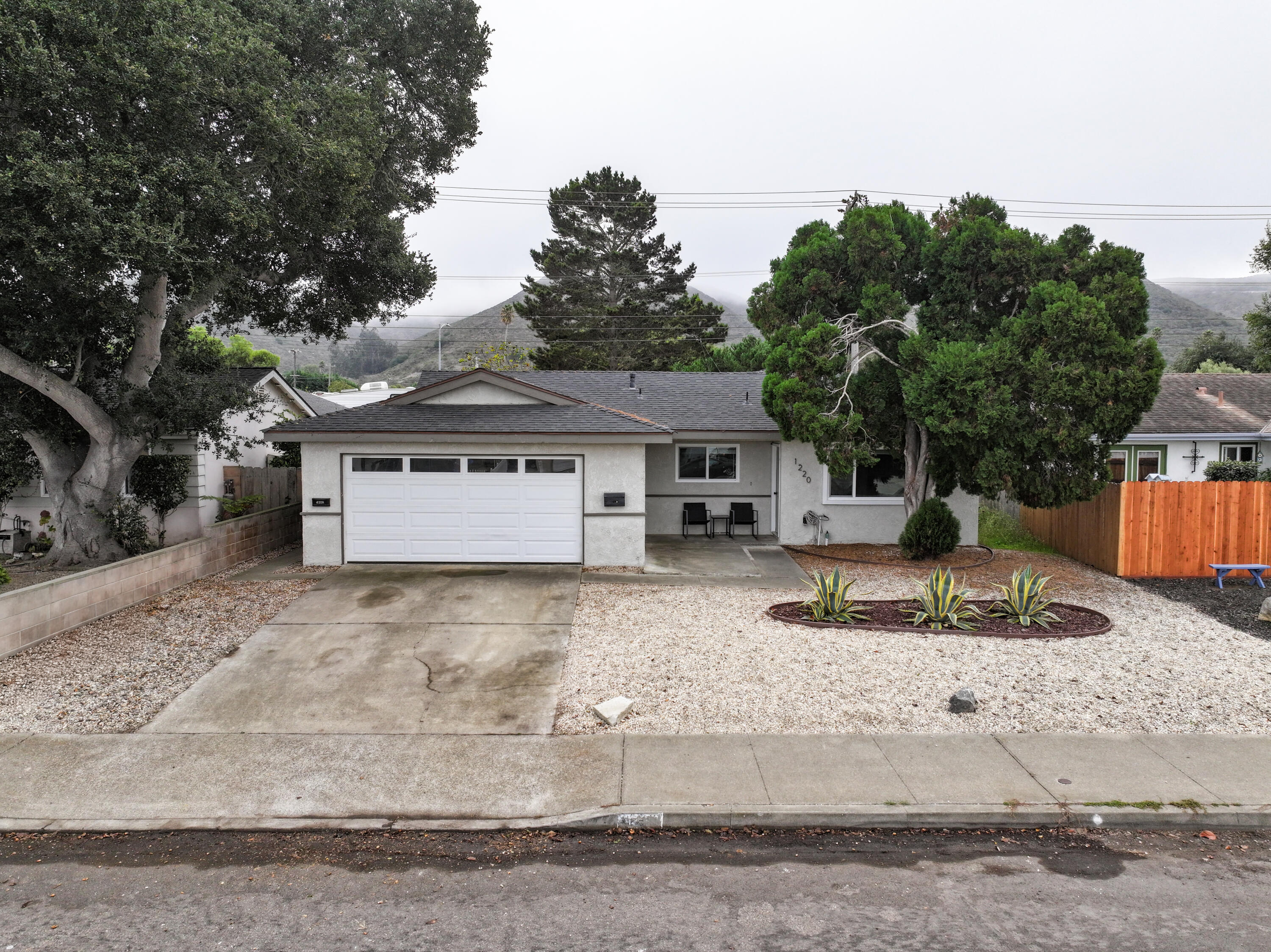 1220 West Lime Avenue Lompoc, CA 93436 - Photo 34 of 48 front view of a house with a yard