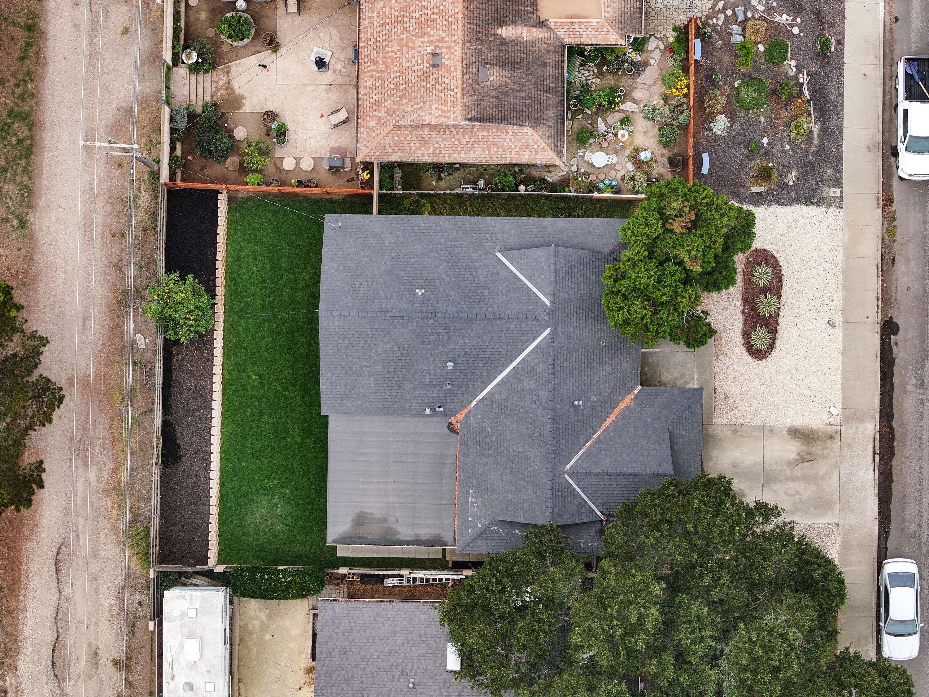 1220 West Lime Avenue Lompoc, CA 93436 - Photo 38 of 48 an aerial view of a house with a yard and a fountain