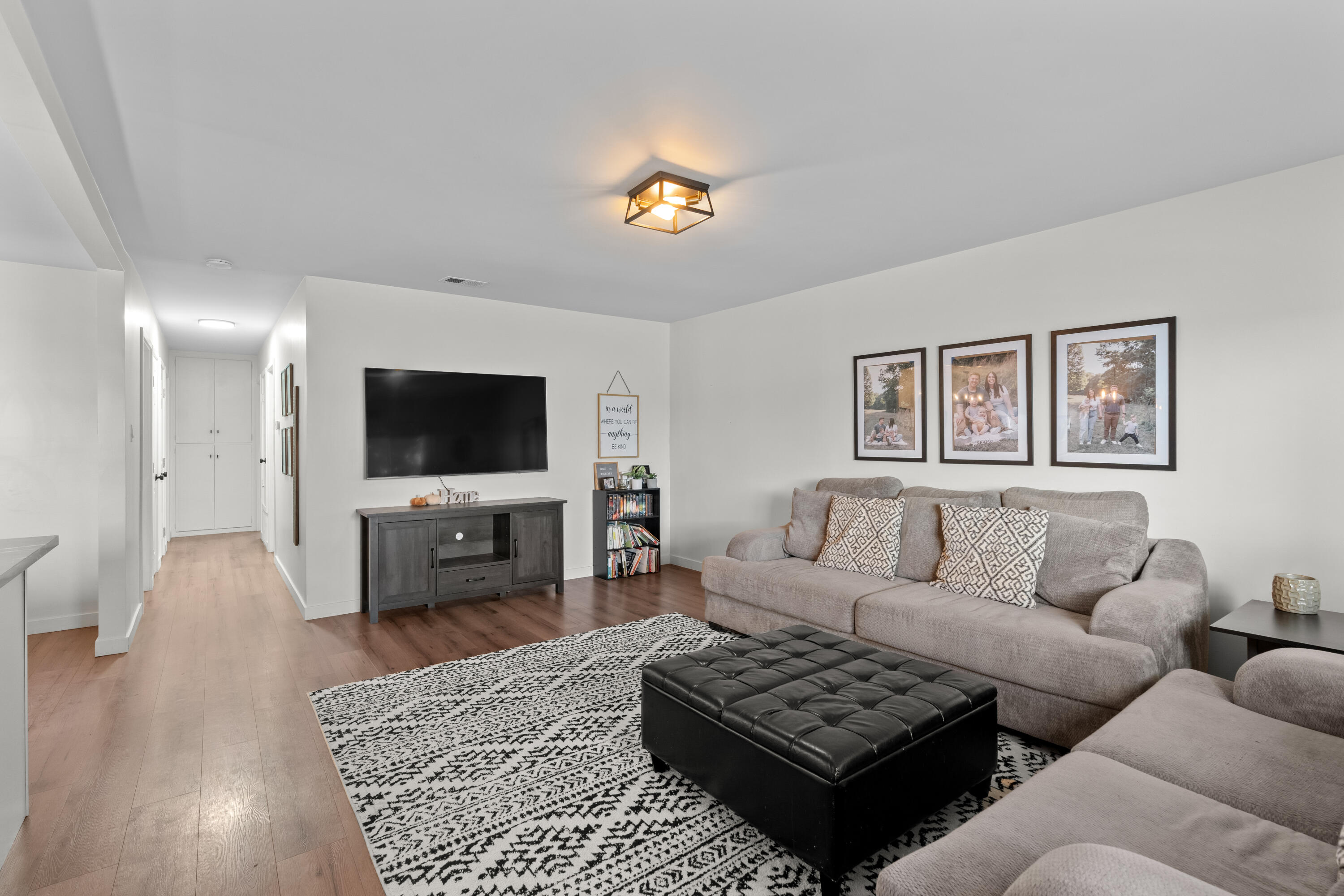 1220 West Lime Avenue Lompoc, CA 93436 - Photo 5 of 48 a living room with furniture and a flat screen tv