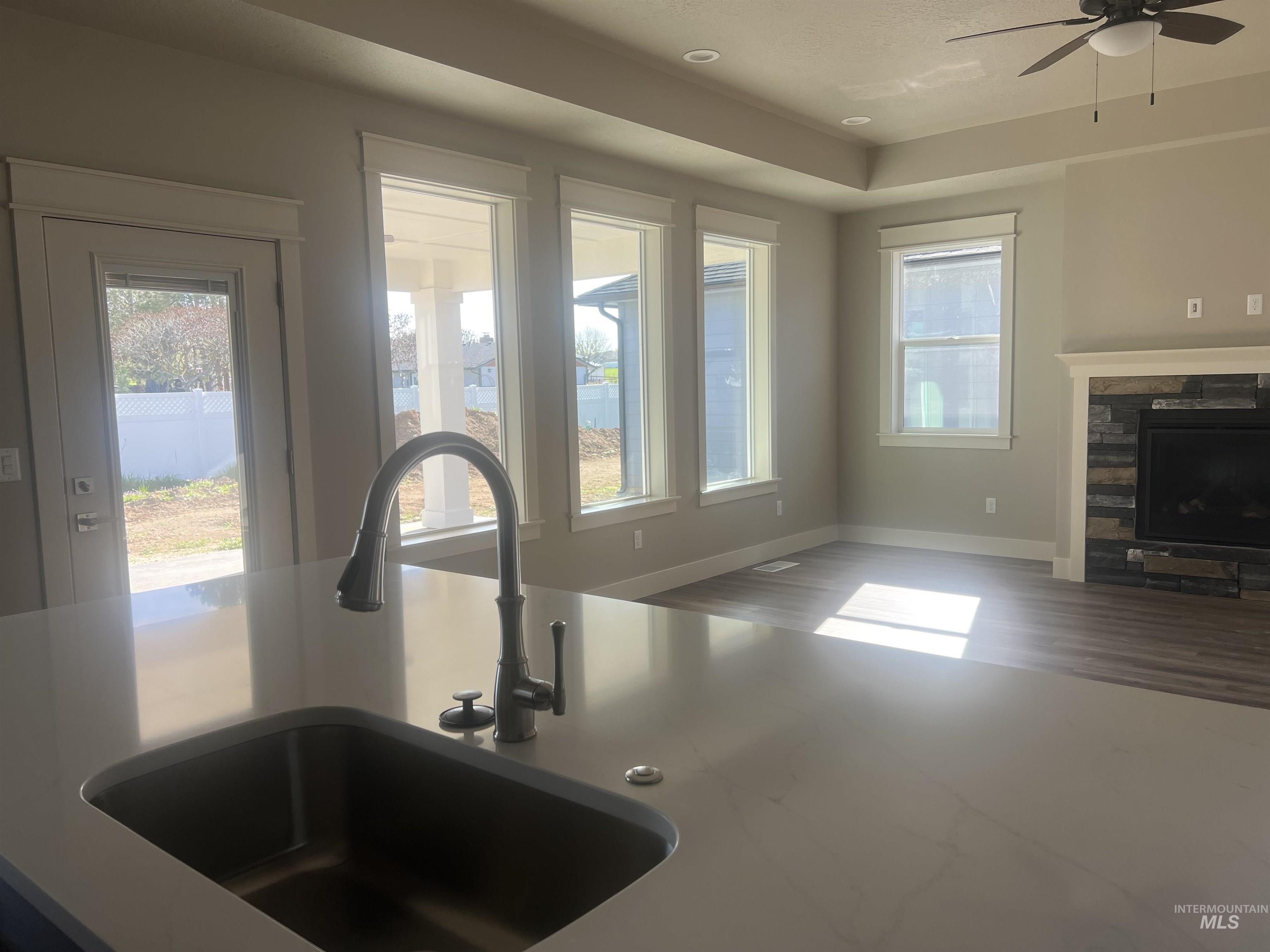 1171 West Recess Way Kuna, ID 83634 - Photo 14 of 15 Kitchen island with an undermount sink and gooseneck faucet