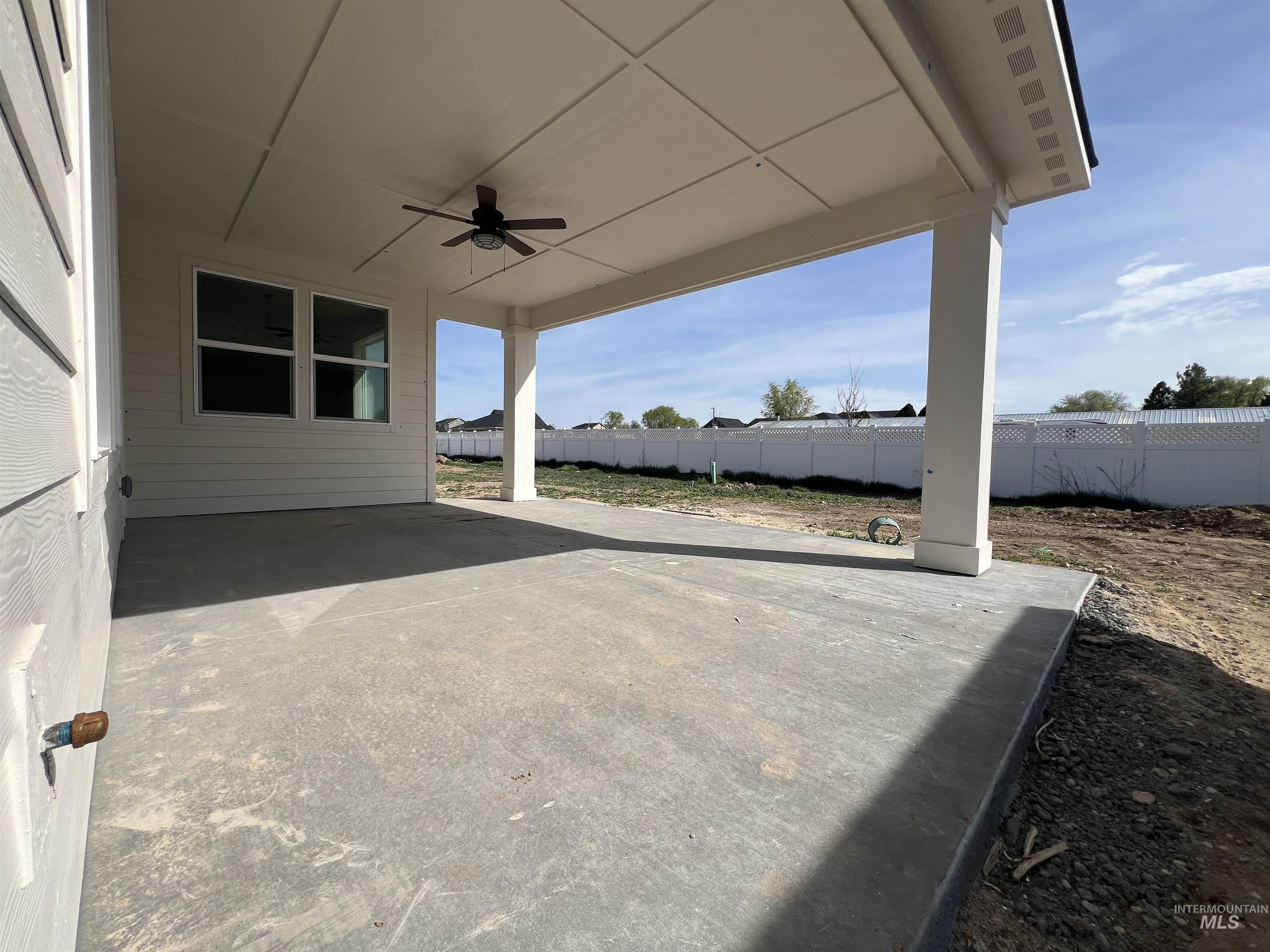 1171 West Recess Way Kuna, ID 83634 - Photo 4 of 15 Fenced backyard featuring a patio and a ceiling fan