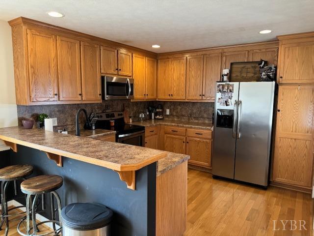 140 Pumping Station Road Spout Spring, VA 24593 - Photo 7 of 18 a kitchen with stainless steel appliances granite countertop a stove refrigerator sink and cabinets