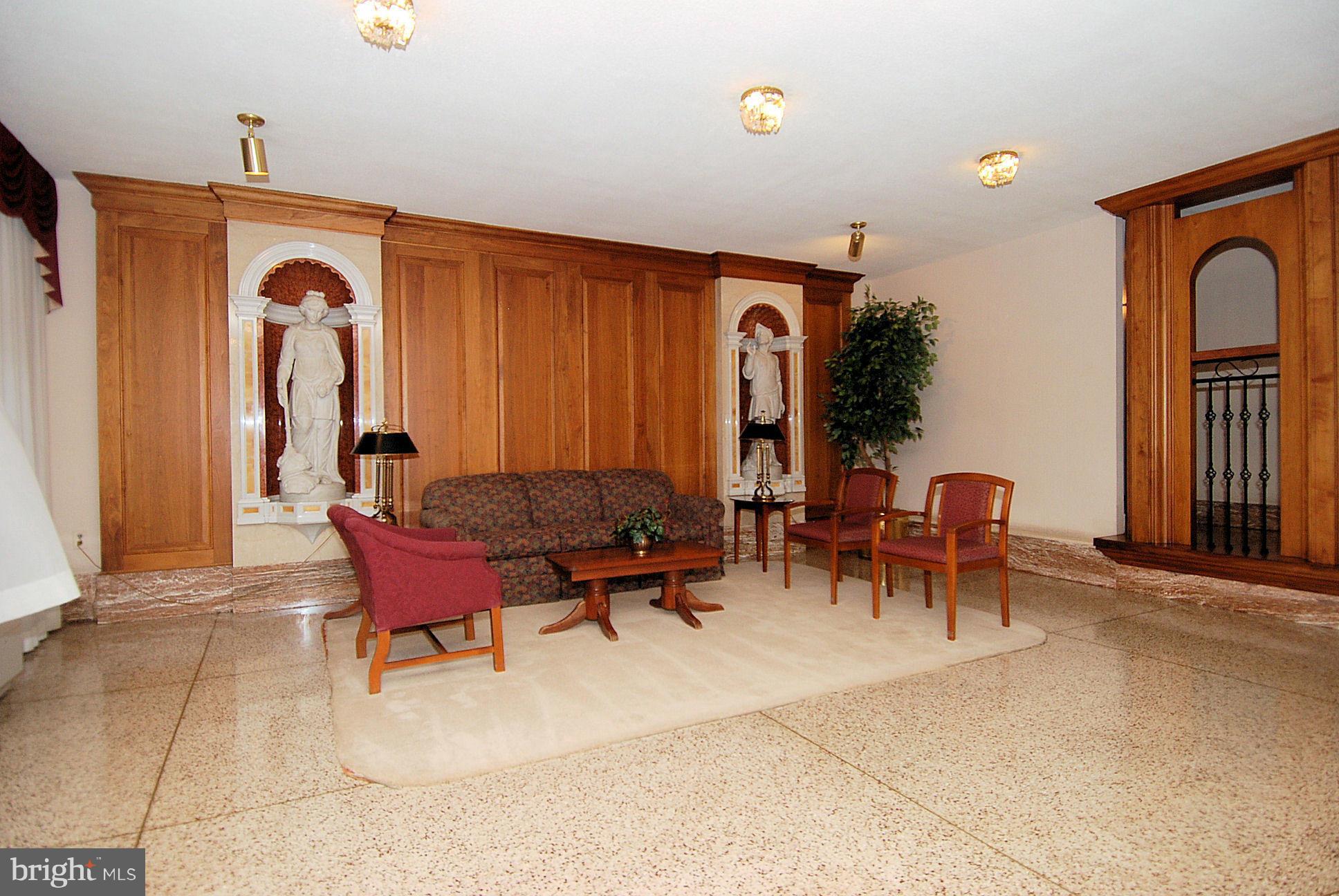 1111 University Boulevard West, Unit 907A Silver Spring, MD 20902 - Photo 6 of 15 a view of a livingroom with furniture and a window