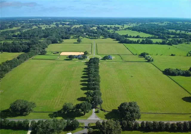 an aerial view of a city with a lake view