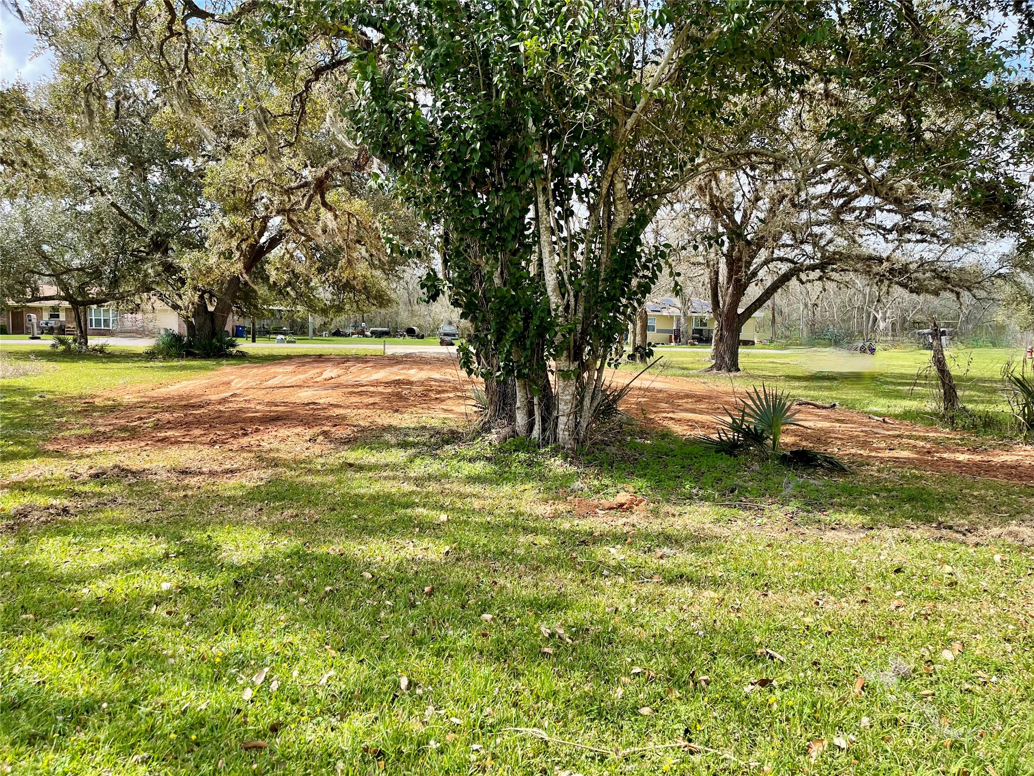 0 Travis Avenue Sweeny, TX 77480 - Photo 6 of 13 a view of a yard with an outdoor space