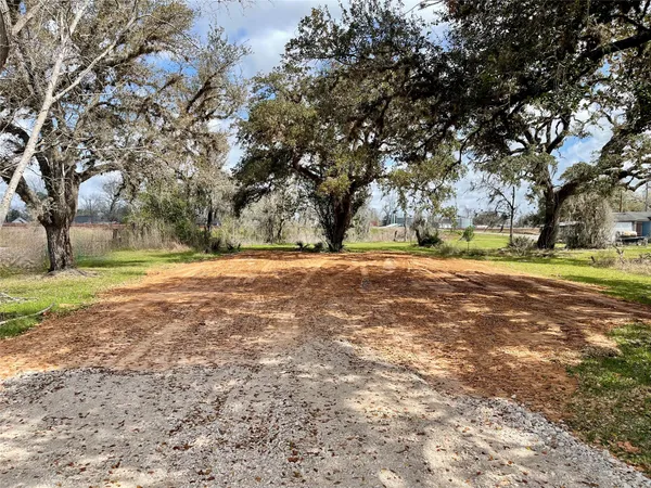 a view of outdoor space with trees all around