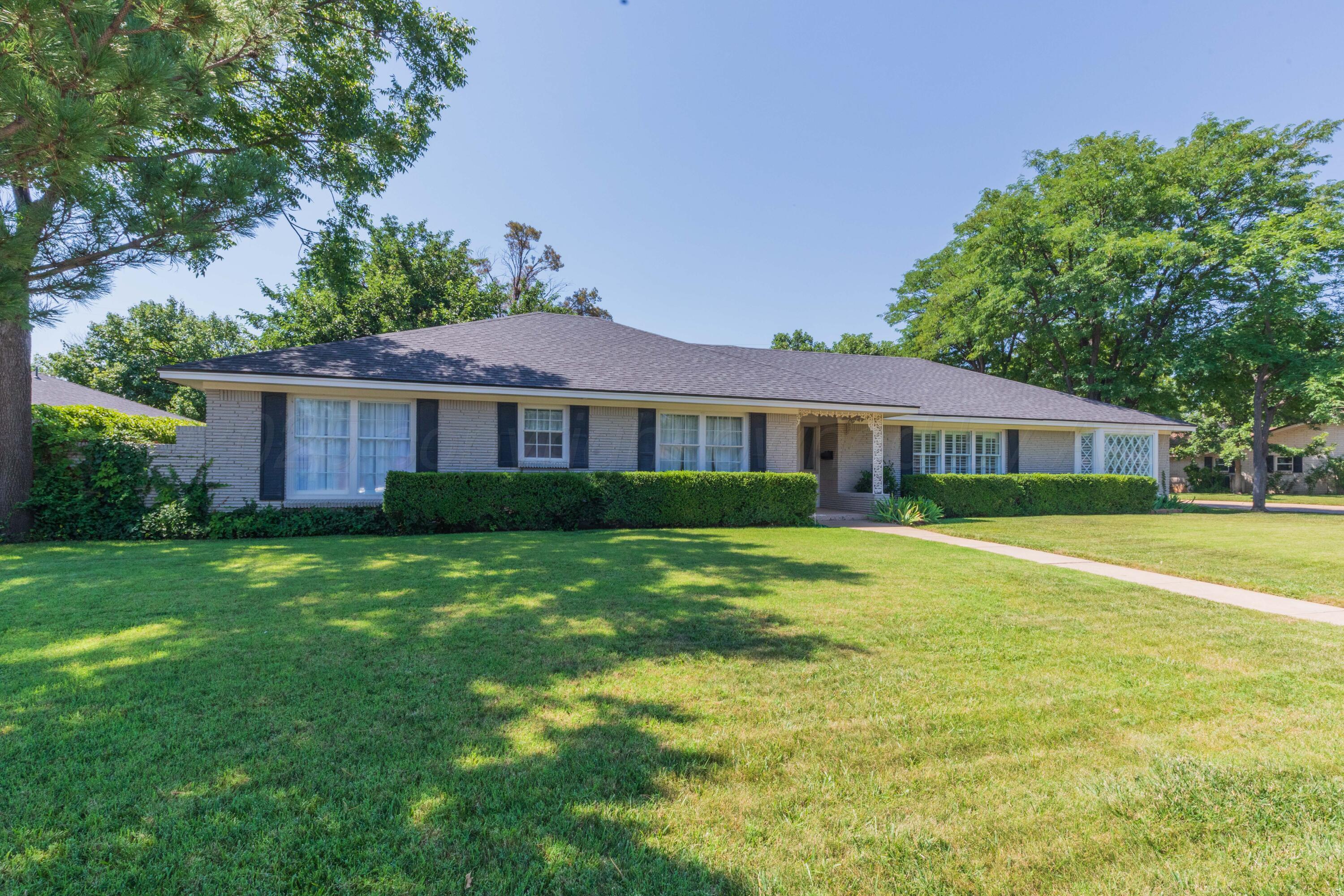 6019 Jameson Road Amarillo, TX 79106 - Photo 1 of 52 a front view of a house with a garden