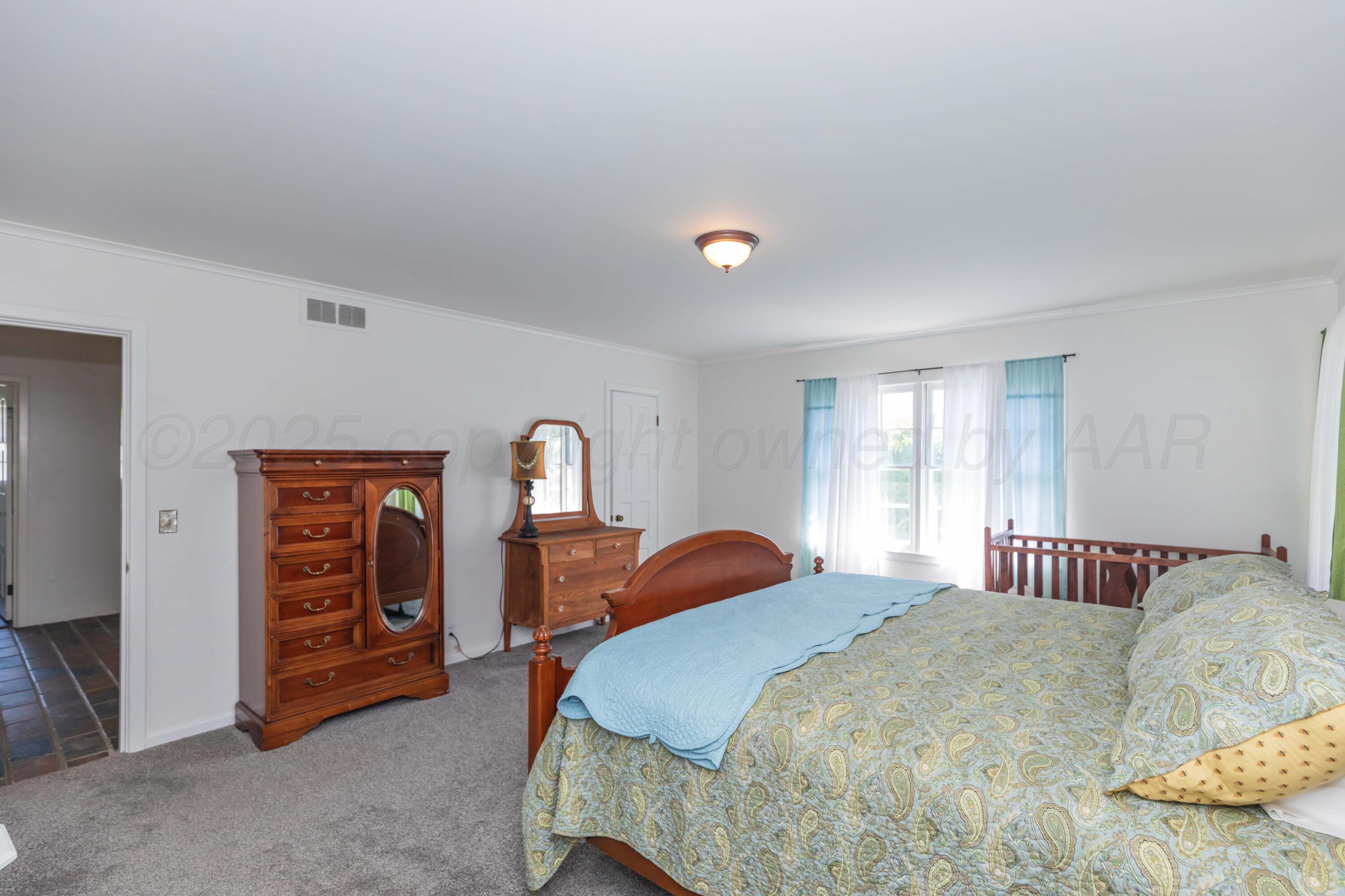 6019 Jameson Road Amarillo, TX 79106 - Photo 14 of 52 a bedroom with a bed and a closet